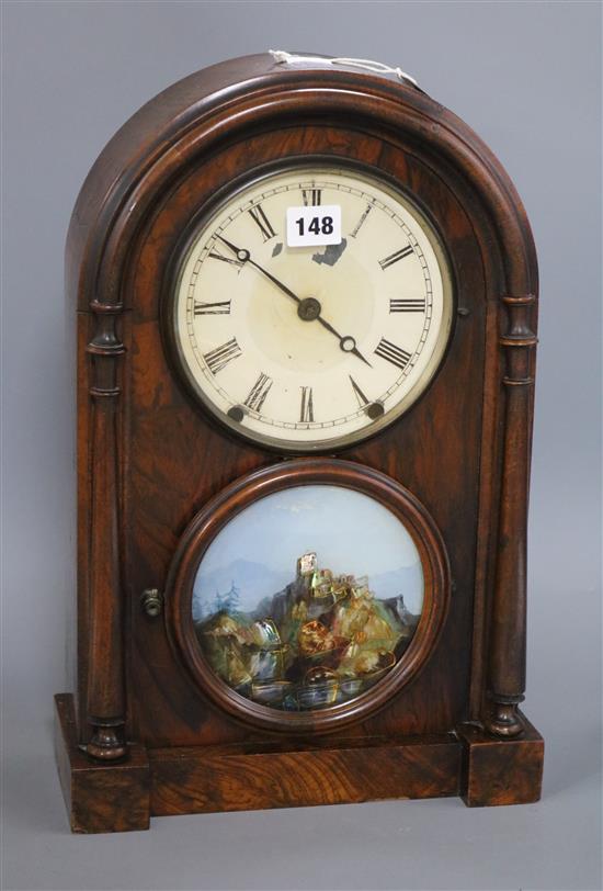 A 19th century walnut mantel clock, with painted glass panel and Roman dial Height 44cm